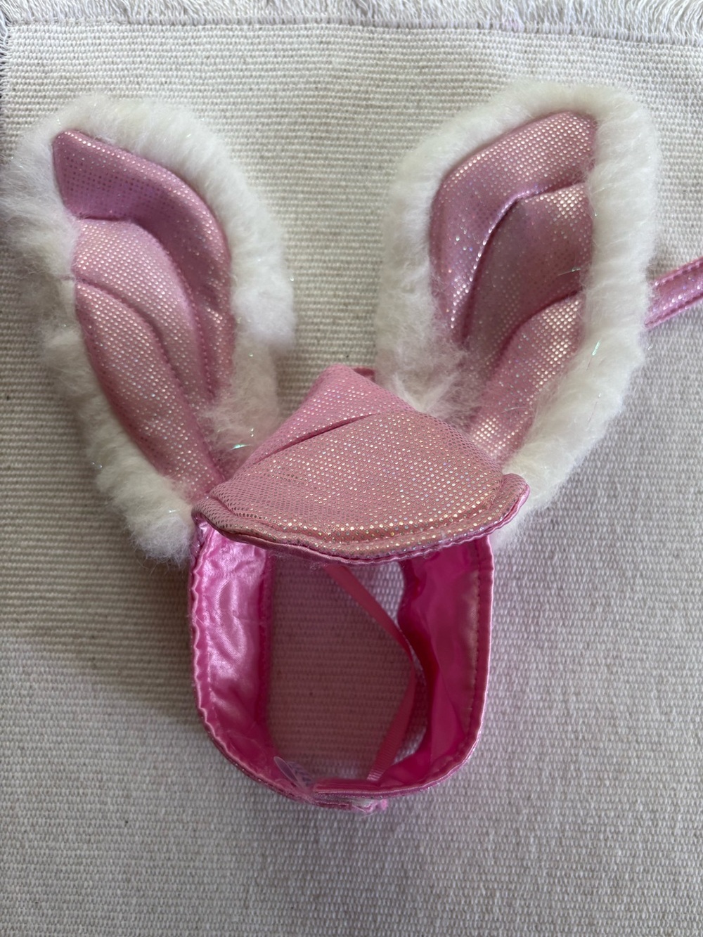 Build-A-Bear bunny ear visor with pink glittery fabric and white faux fur trim.